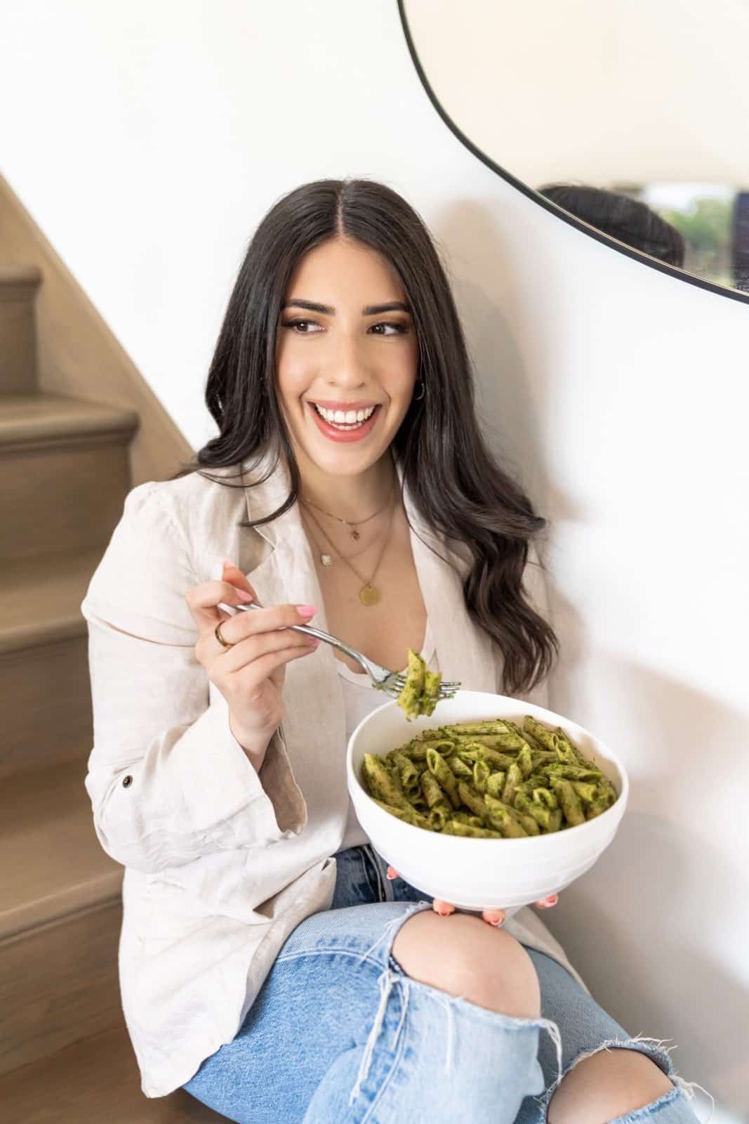 Danielle Brown eating pesto pasta bowl